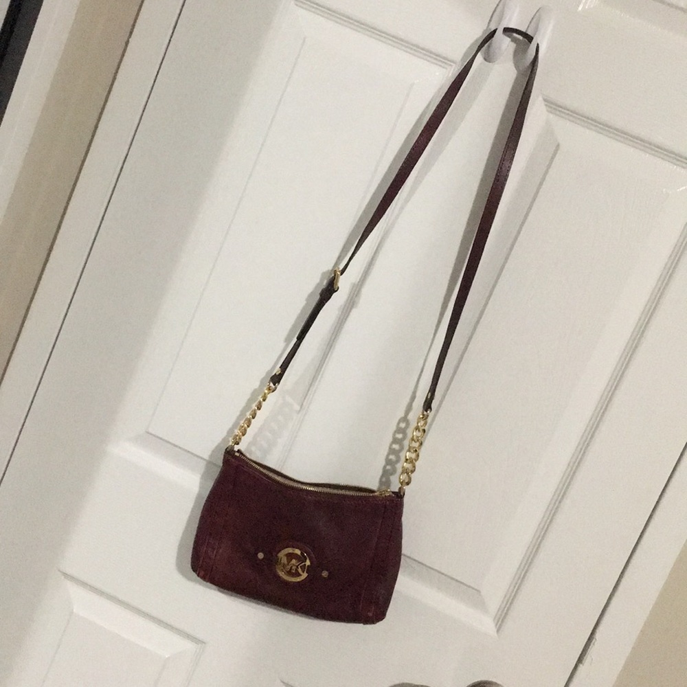 Small maroon and gold Michael Kors crossbody bag